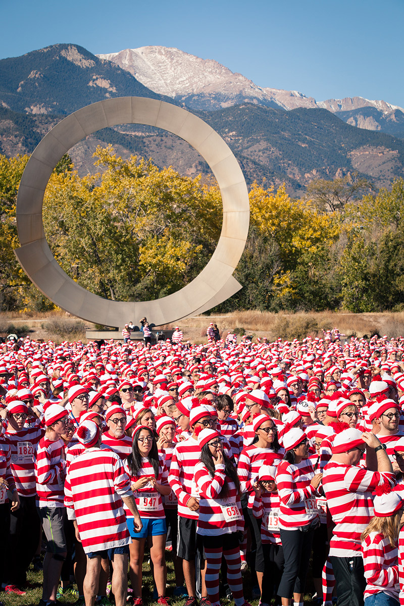 A crowd of Waldos in America the Beautifl Park with Pikes Peak in the background